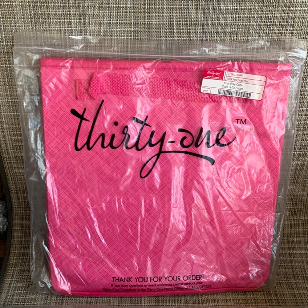 This beautiful HOT hot pink organizer cube by Thirty One.